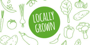 "Locally Grown" in a green circle surrounded by drawings of vegetables